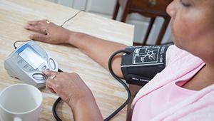BP-Check_woman-checking-blood-pressure-monitor_1col.jpg