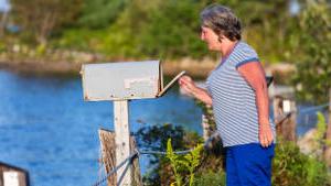 senior-woman-mailbox-lake-1col.jpg